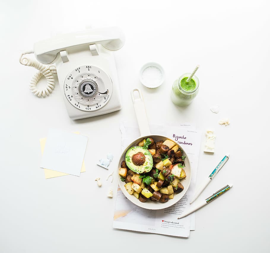 white, rotary, telephone, foods, fruit, salad, bowl, pens, papers, jar