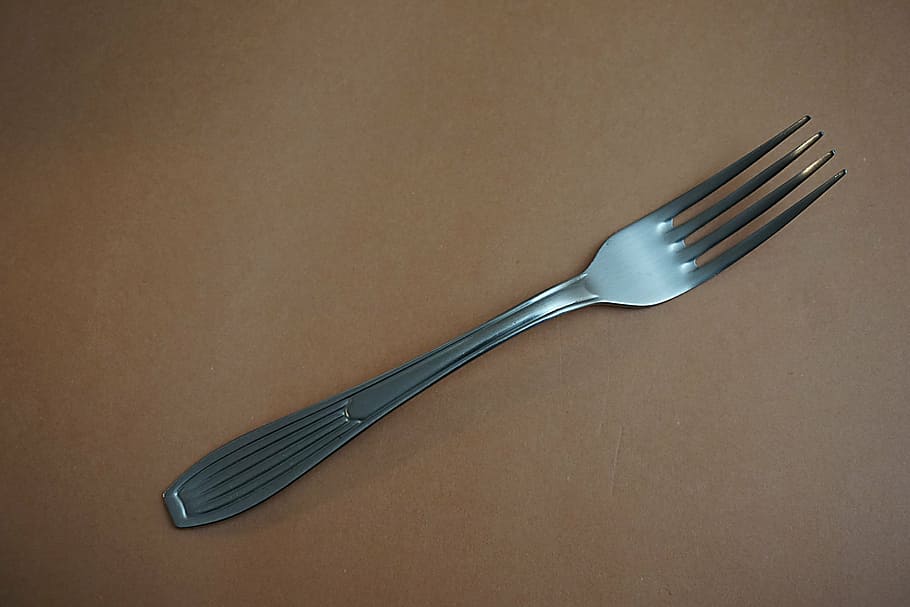 stainless, steel fork, brown, surface, fork, metal, steel, table, thing, utensil