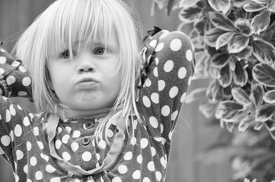 girl, wearing, black, white, polka-dot clothes grayscale photo, child, blond, pout, offended, cute