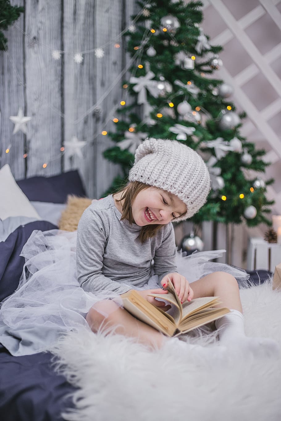 girl, gray, sweatshirt, kit cap, sitting, bed, new year's eve, kids, child with a book, new year