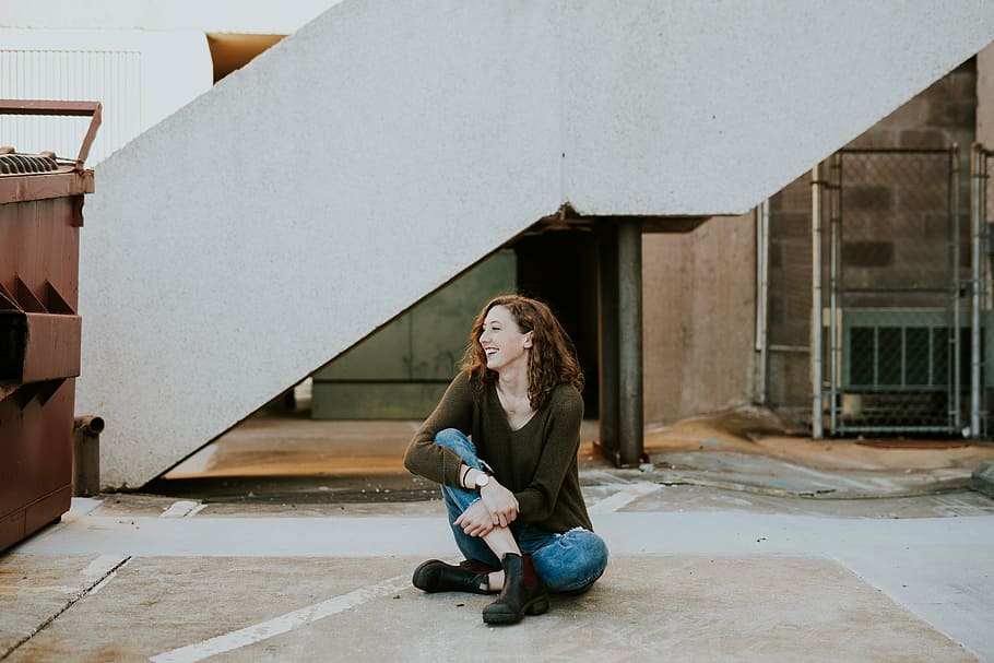 woman, squatting, floor, people, happy, brunette, casual, sadness, building exterior, abandoned