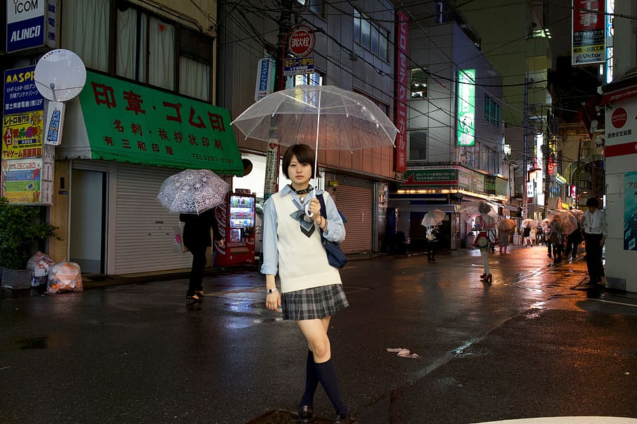 woman, holding, clear, umbrella, wearing, white, blue, collared, long-sleeved, shirt