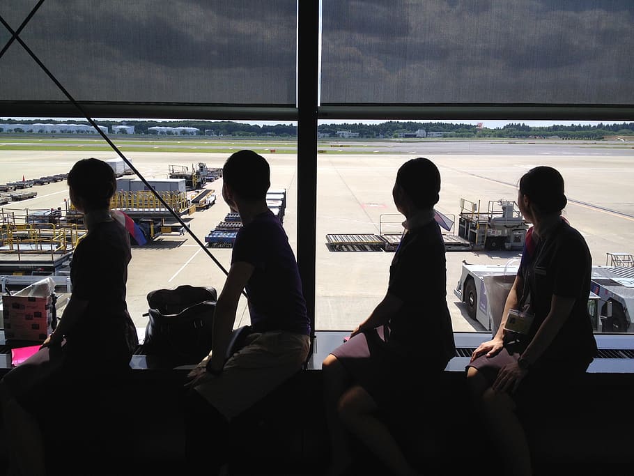 cabin attendant, shadow, airport, group of people, men, real people, window, sitting, transportation, people
