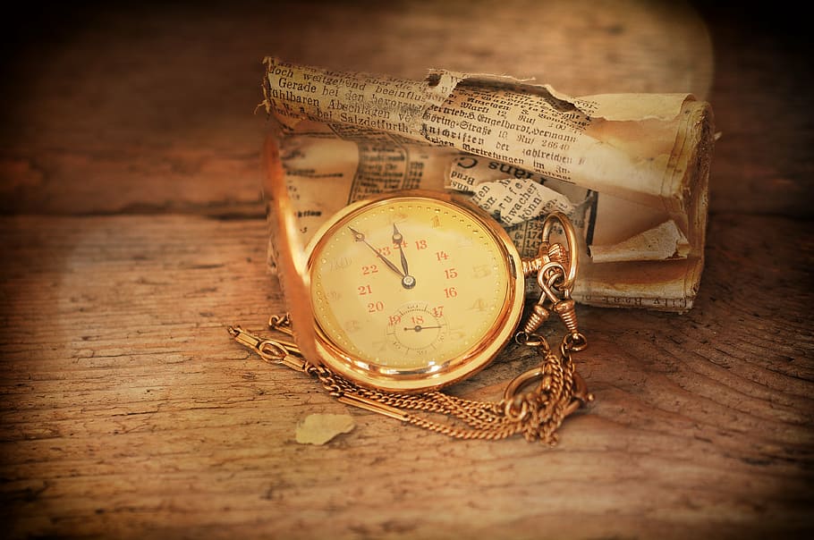 gold-colored pocket watch, pocket watch, clock, clock face, jewellery, newspaper, newsprint, daily newspaper, rolled, crumpled