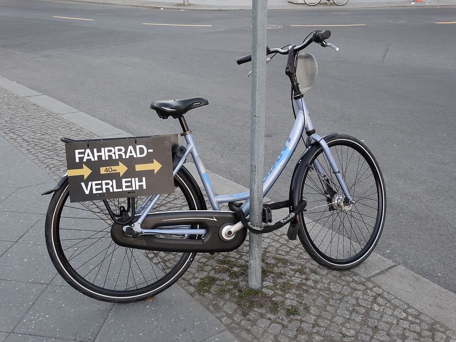 bike, claim, bicycle, transportation, land vehicle, mode of transportation, sign, text, city, communication