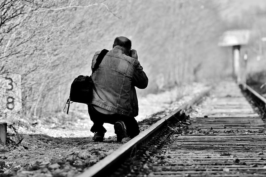 man, kneel, trail railway, holding, camera, disused railway line, railway station, photographer, photograph, seemed