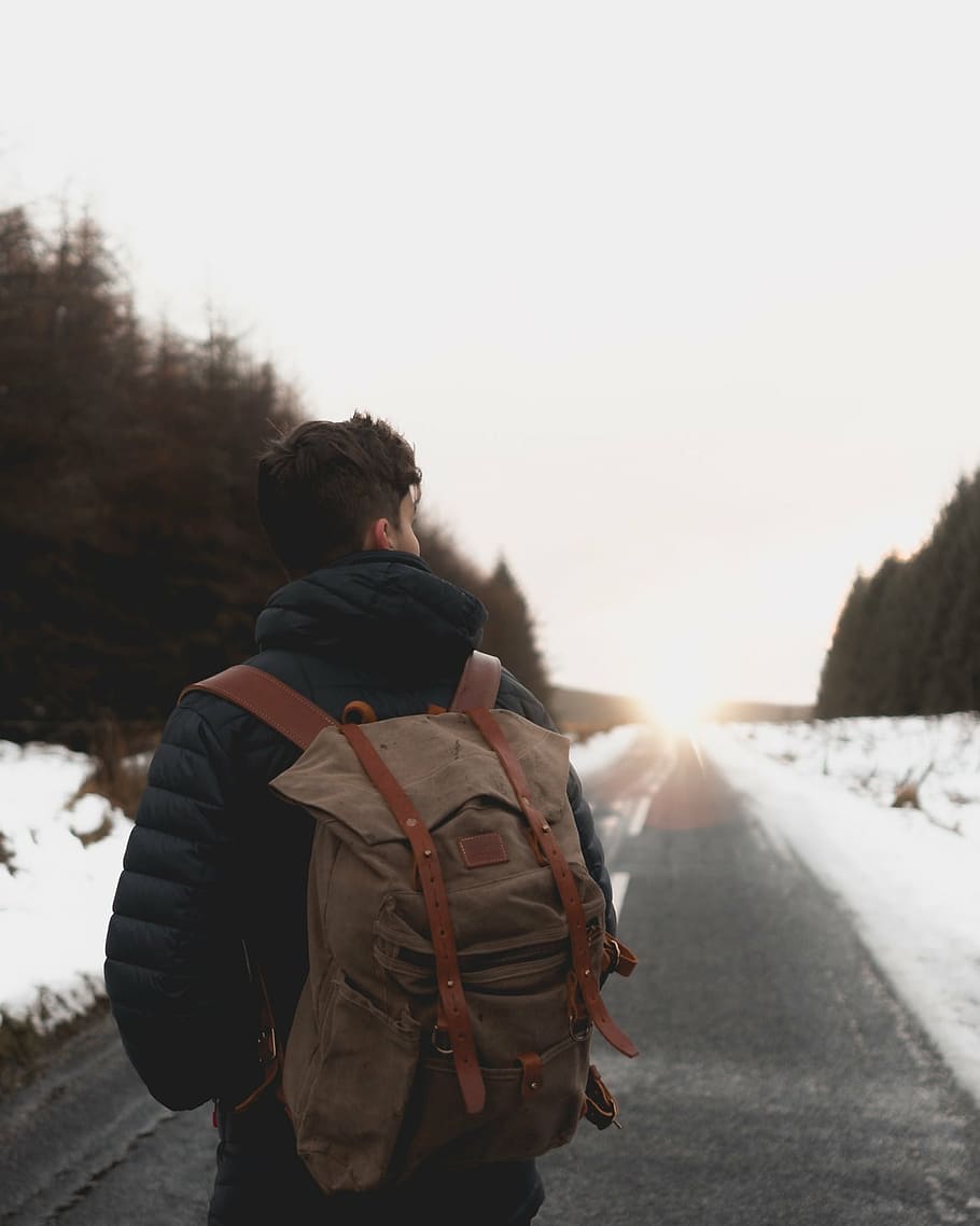 man, wearing, brown, backpack, standing, gray, road, daytime, snow, winter