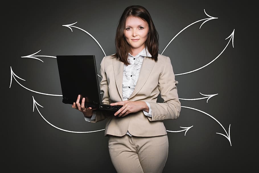 woman, wearing, grey, blazer, bottoms, smiling, holding, laptop computer, analytics, computer