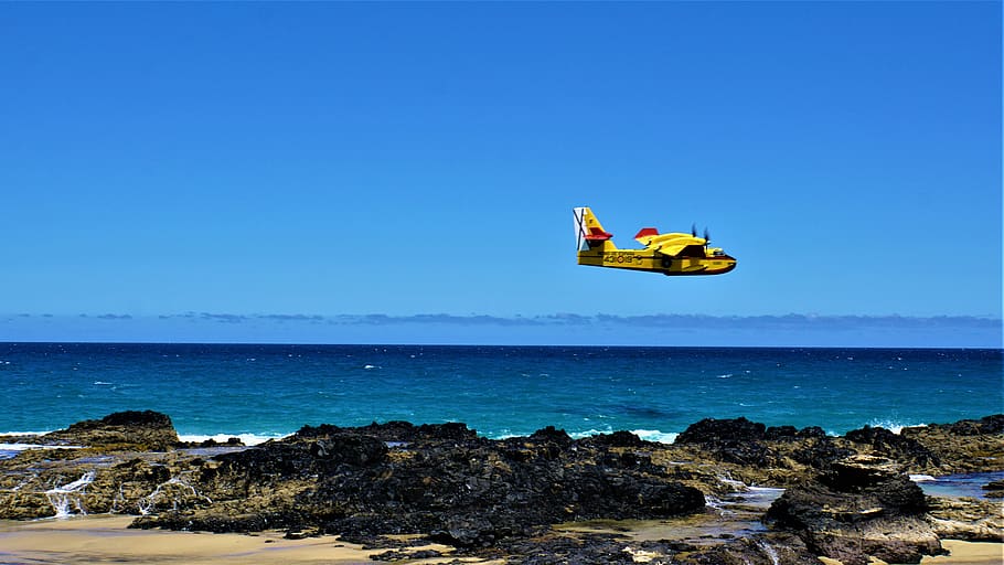 light aircraft, propeller plane, ocean, sea, rock, cliff, fuerteventura, island, canary islands, sky