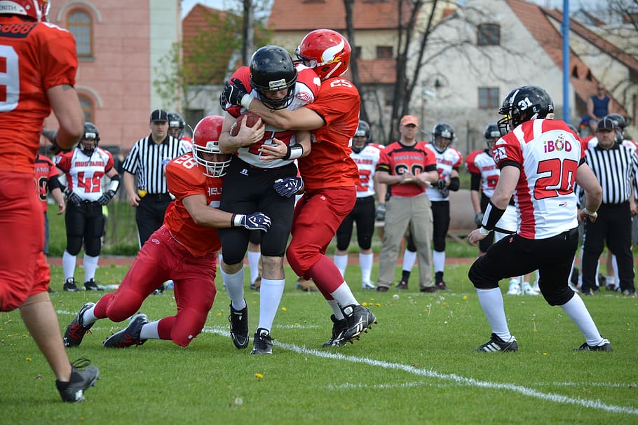 rival, stopping, american football, ball, sport, group of people, clothing, american football - sport, real people, helmet