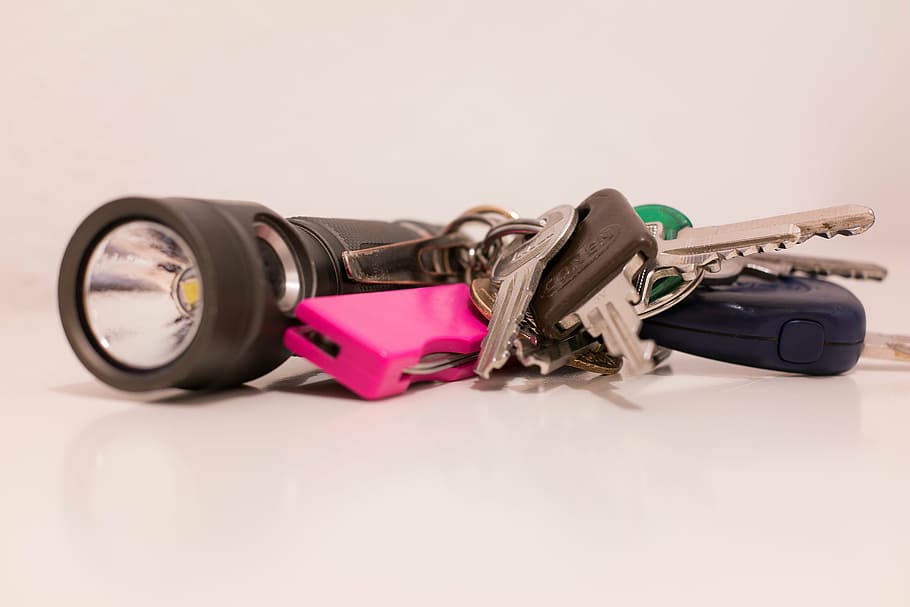 several, gray, keys, keychain, black, flashlight, key, pocket knife, door key, house keys