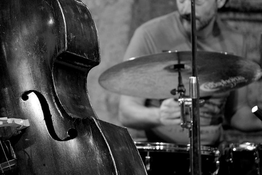 grayscale photo, cello, jazz, double bass, music, concert, musical instrument, drums, lectern, arts culture and entertainment