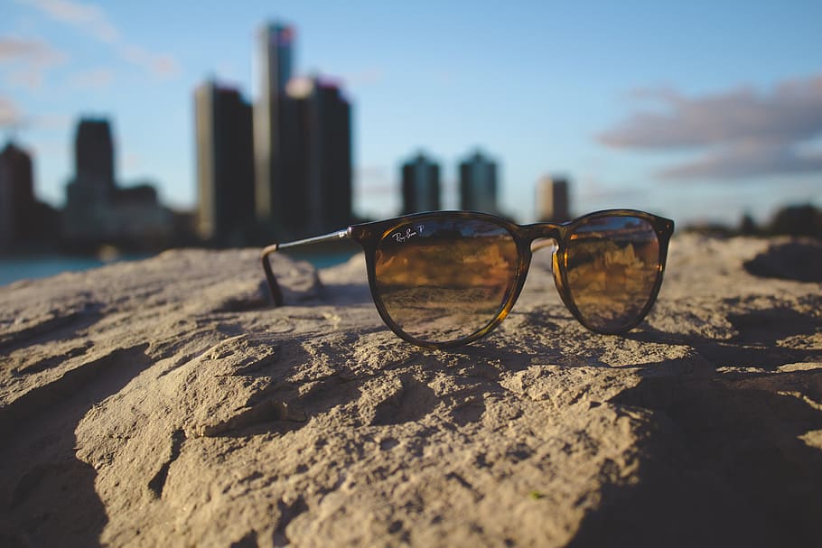 ray-ban sunglasses, rock, buildings, macro, sunglasses, water, glasses, fashion, sky, focus on foreground