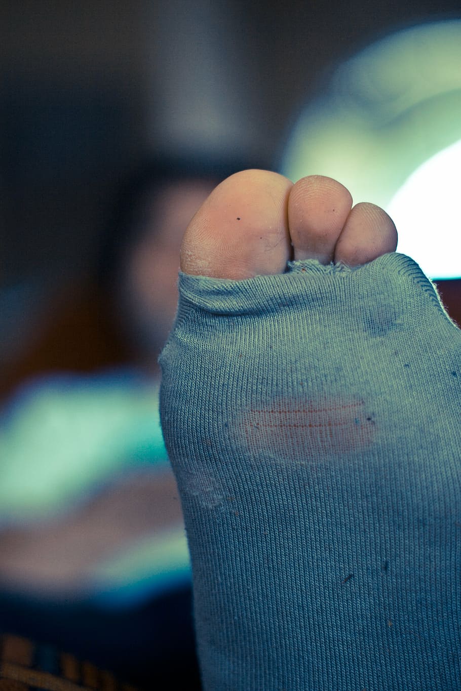 person, wearing, gray, sock, holes, socks, toes, toe, foot, toenail