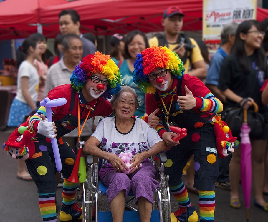 woman, wheelchair, two, clown, festivity, daytime, in between, street party, carnival, costume