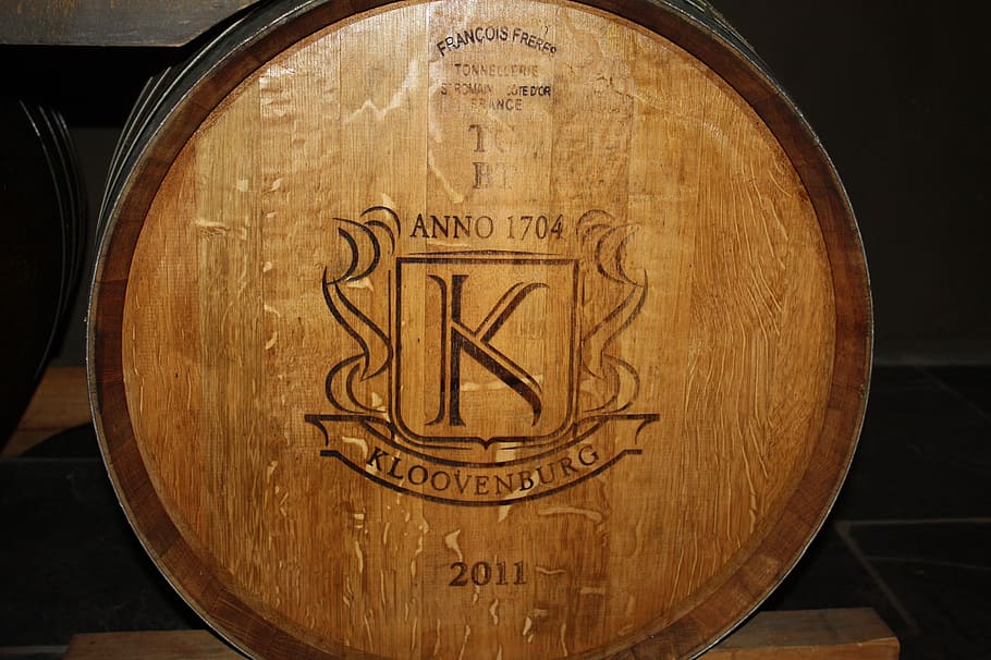 wine barrel, wooden barrels, barrel, wine storage, wood - material, text, indoors, brown, close-up, western script