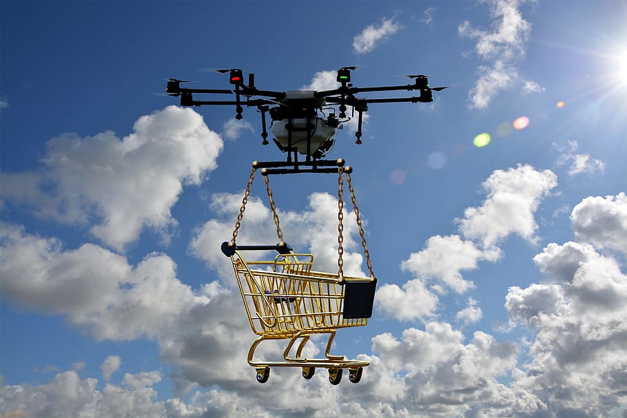 white, black, drone, lifting, yellow, shopping cart, daytime, logistics drone, package drone, unmanned
