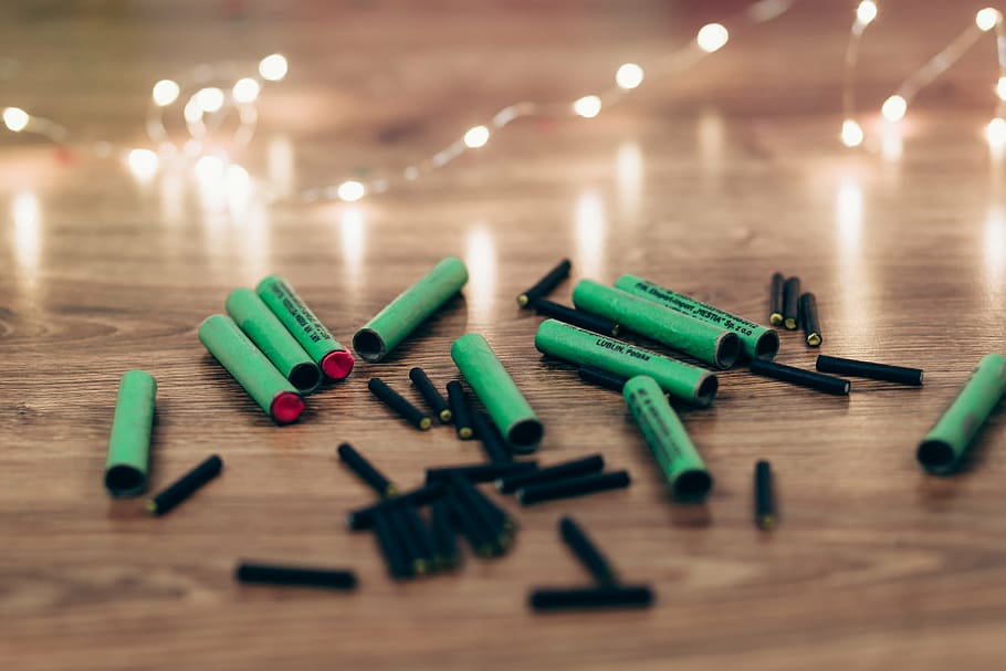 closeup, black, green, firecrackers, brown, wooden, surface, plastic, material, reflection