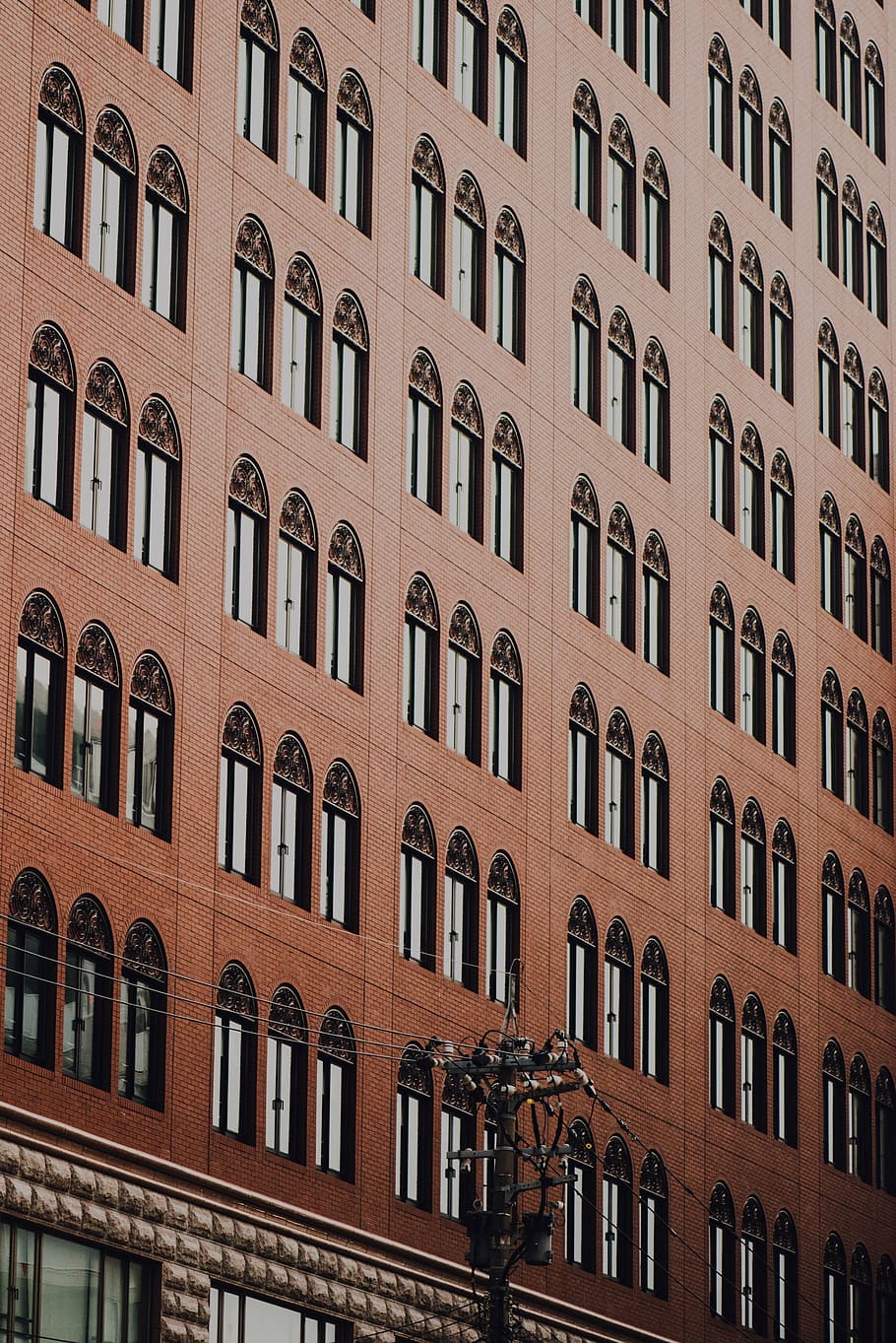 brown painted building, brown, building, architecture, infrastructure, facade, window, residential building, apartment, building exterior