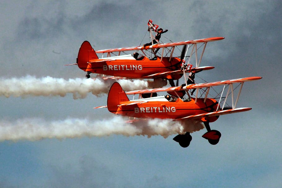 biplane, contrails, vapor trails, airplanes, wing walking, wing walker, air walkers, airshow, airplane stunts, aircraft