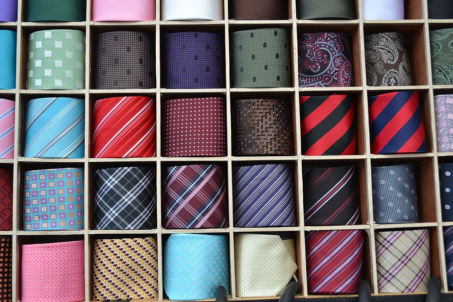 assorted-color-and-pattern necktie lot, silk tie, sales man, collection of ties, array, assorted, assortment, red, blue, black green