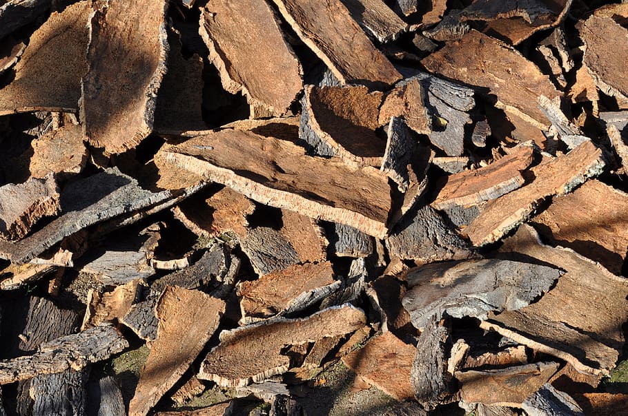 pile, brown-and-black firewood lot, cork oak, cork, tree bark, natural product, cork board, layer, bark, peeled