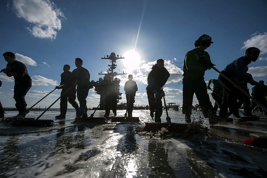 silhouette photo, people, working, daytime, teamwork, sailors, cleaning, silhouettes, wash down, flight deck