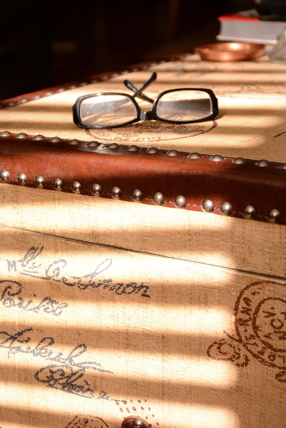 old, leading lines, box, glasses, vintage, negative space, sunlight, text, chest, type