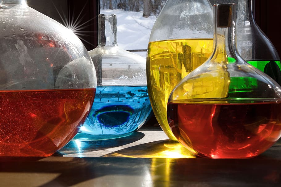 decanters, filled, liquid, green, yellow, blue, red, colored, liquids, in clear, glass