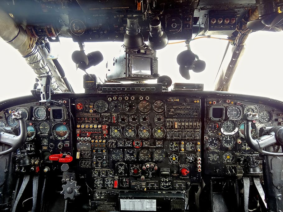 black helicopter interior, cockpit, aircraft, driver, control, airplane, air vehicle, transportation, mode of transportation, vehicle interior