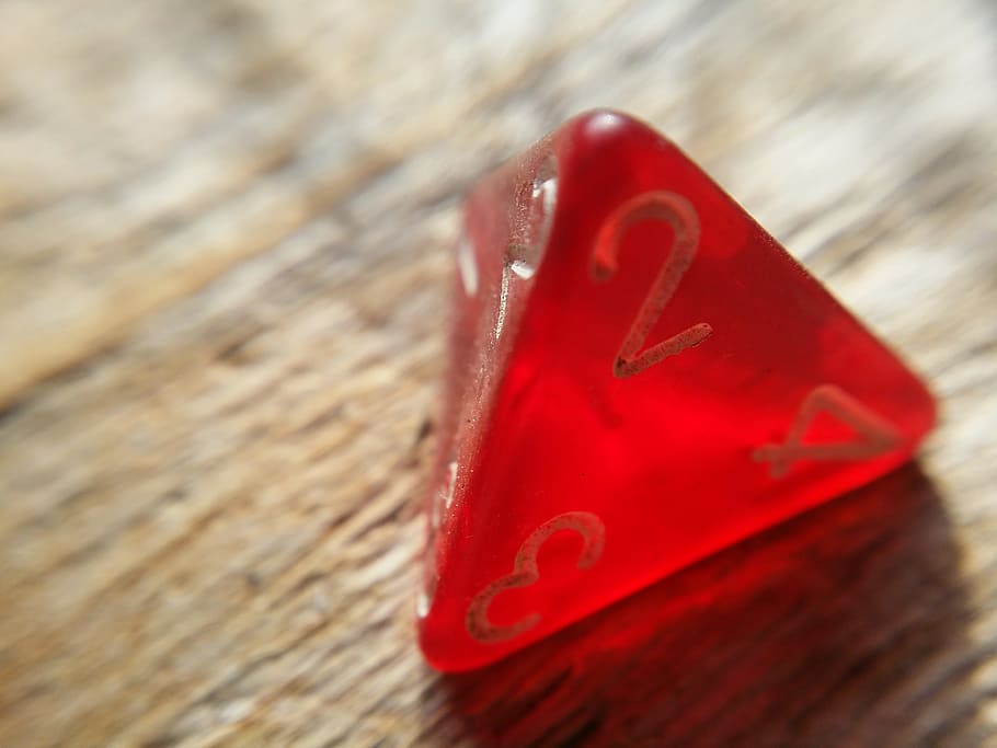 close-up photography, triangle, red, dice, brown, wooden, surface, game, rpg, d4