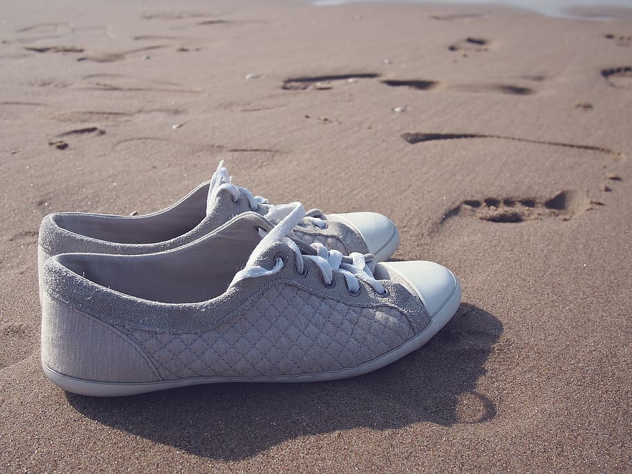 pair, gray-and-white low-top sneakers, sand, daytime, gray, white, low, tops, sneakers, brown