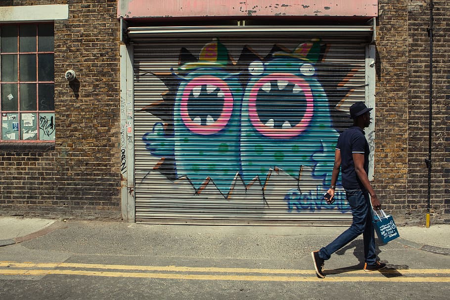 street photo, london man, shopping bag, bag., east, london street art, seen, background, man, East London