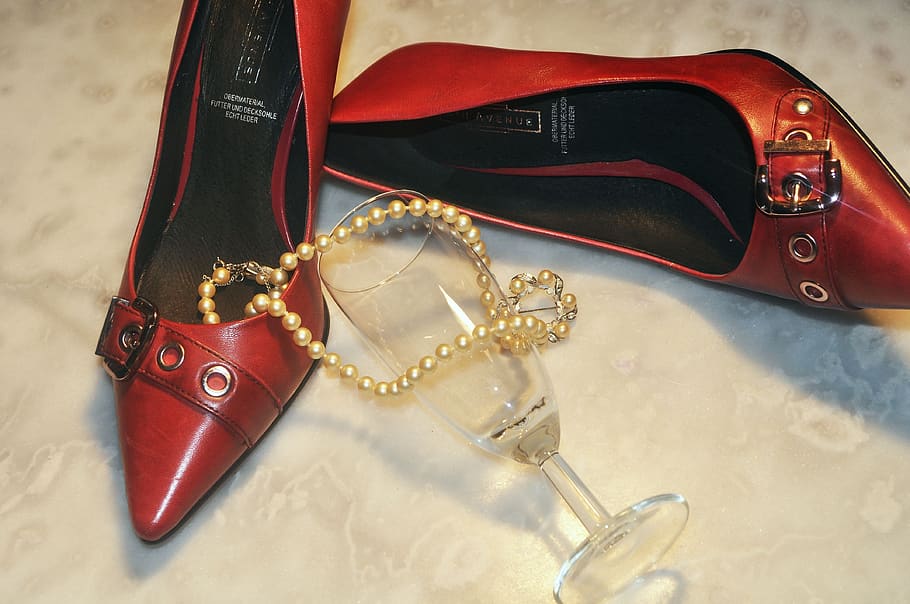 red boots, glass, beads, chain, still life, jewelry, close-up, necklace, indoors, high angle view