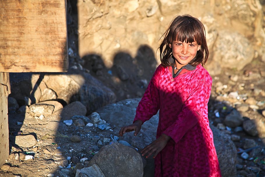 girl, wearing, pink, dress, rocks, cute, afghanistan, person, alone, child