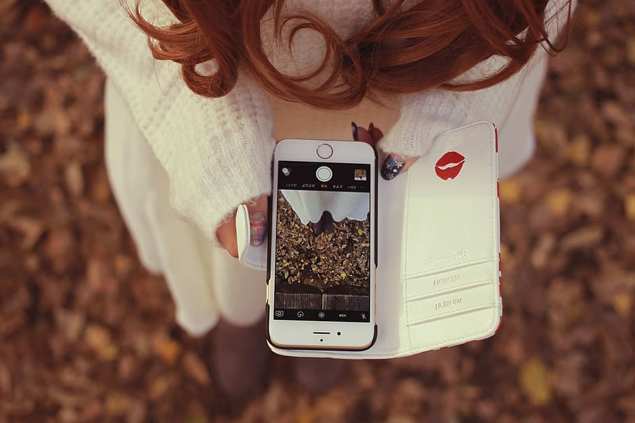shallow, focus photography, woman, white, sweater, holding, gold iphone 6, showing, camera interface, shallow focus