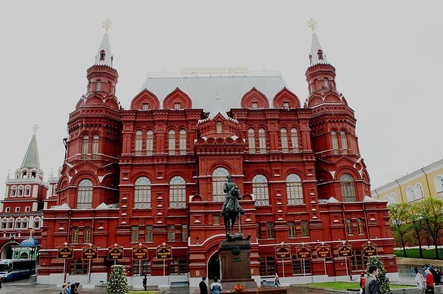 red building, windows, silver roof, towers and spires, historic, architecture, museum, statue of war marshall, overcast sky, red