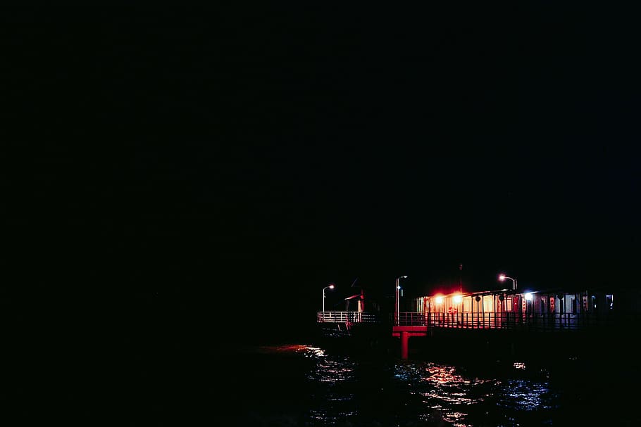 silhouette, dock bridge, white, lighted, house, near, body, water, dark, night