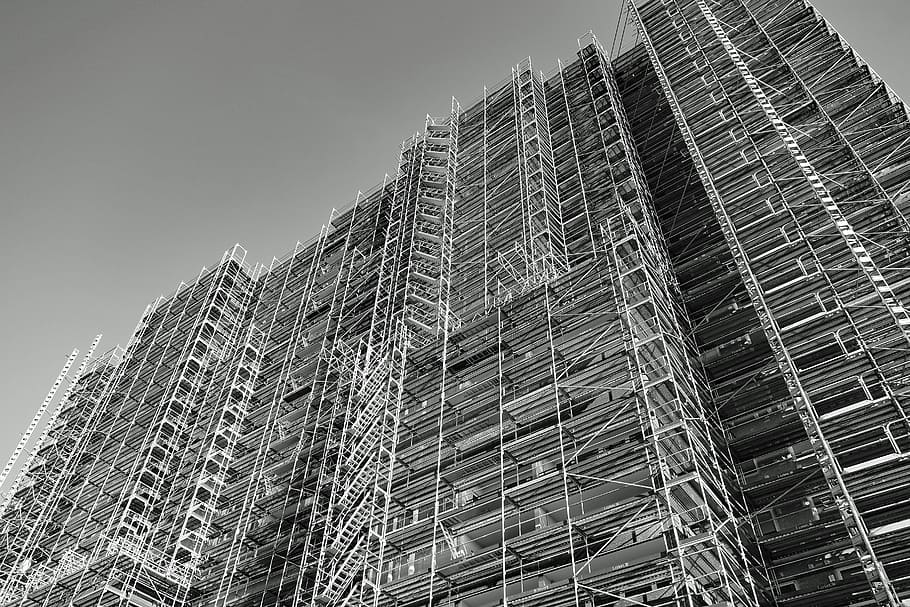 skyscraper, scaffold, scaffolding, architecture, building exterior, low angle view, built structure, building, city, sky