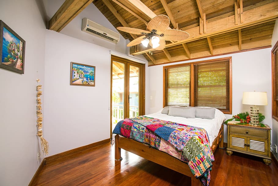 white, multicolored, floral, bedspread, beach house, interior, palmetto coasts, vacation home, hotel room, bedroom