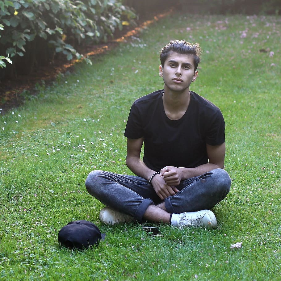 i am, sitting, one person, casual clothing, full length, young adult, grass, young men, front view, plant