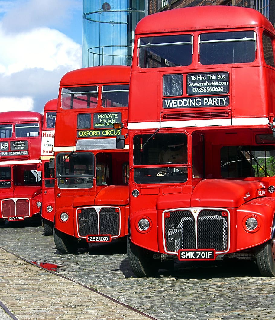 four, red, double-decker, bus, parked, building, transportation, vehicle, touring bus, transport