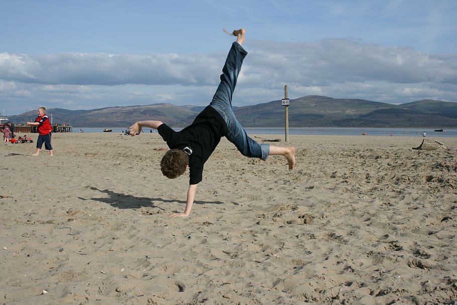 child cartwheeling, seashore, boy, child, beach, handstand, gymnastics, beautiful beaches, playing, sandy beach