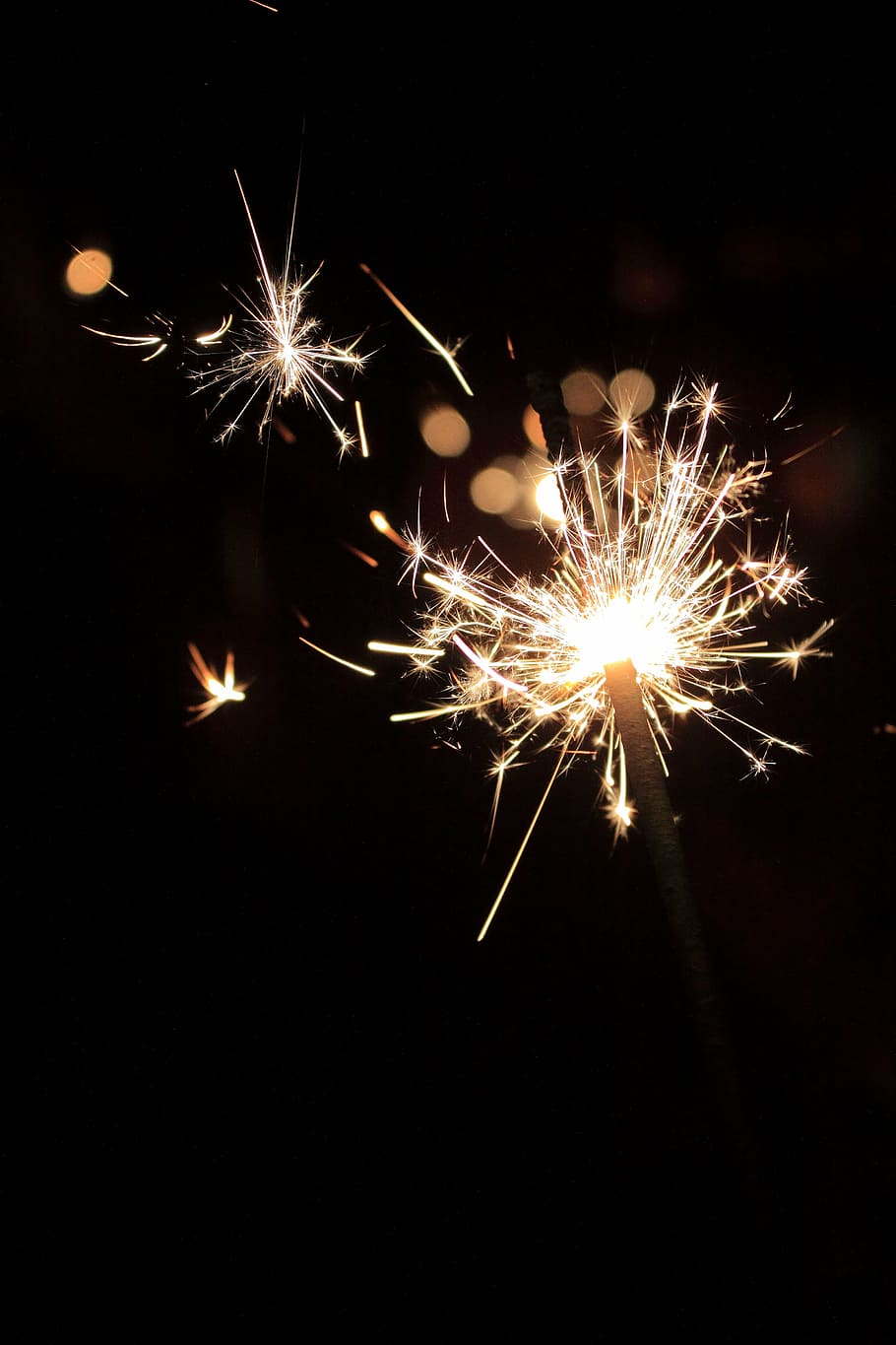 lighted sparkler, new year's eve, sparkler, radio, fireworks, firework - man made object, firework display, sparks, celebration, arts culture and entertainment