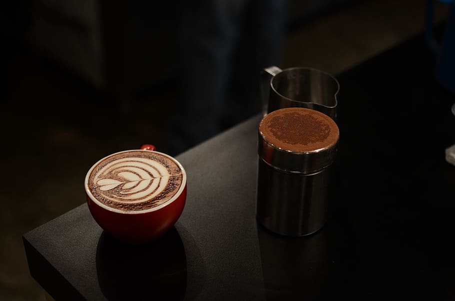 red, white, ceramic, cup, black, wooden, surface, coffee, latte, art