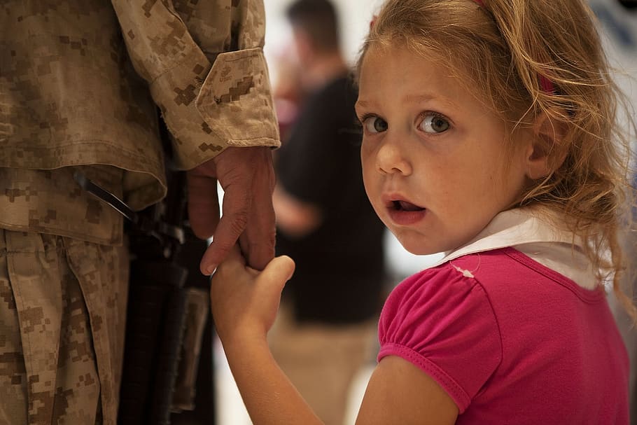 girl, pink, shirt, holding, hand, woman, soldier, daughter, child, looking