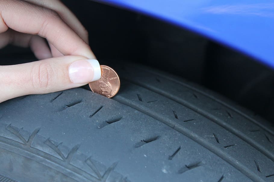 person, holding, coin, vehicle tire, penny, profile, test, tread, wheel, tire