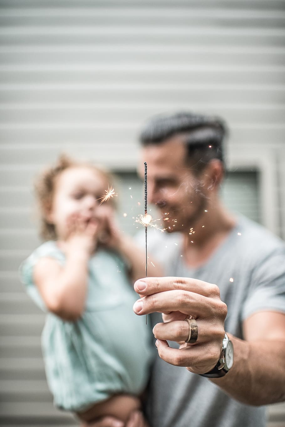 man holding sparklers, people, parent, man, father, carry, daughter, kid baby, child, hand