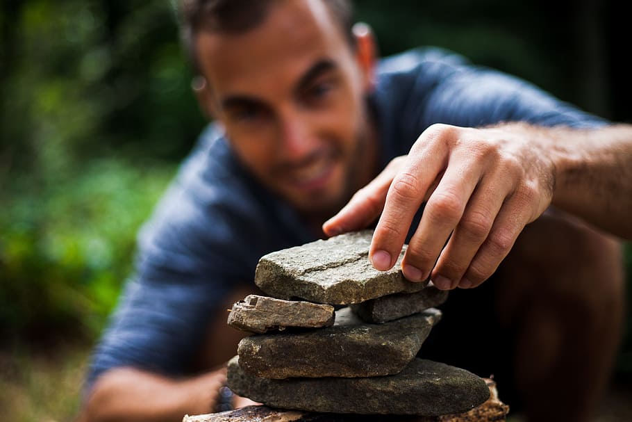 person stacking stones, building, zen, man, boy, pyramid, game, builds, nature, young