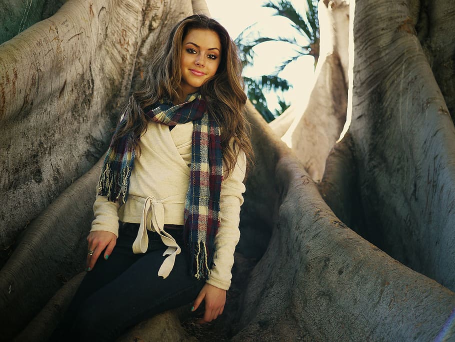 woman, standing, tree, daytime, girl, beautiful, long wavy brown hair, smiling, scarf, sitting